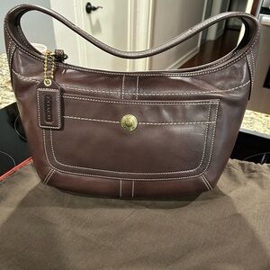 Brand new Coach handbag! Never been used and still has the original bag cover.